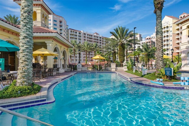 200 Ocean Crest Dr Unit 913, Palm Coast, FL 32137 - community pool featuring a patio area