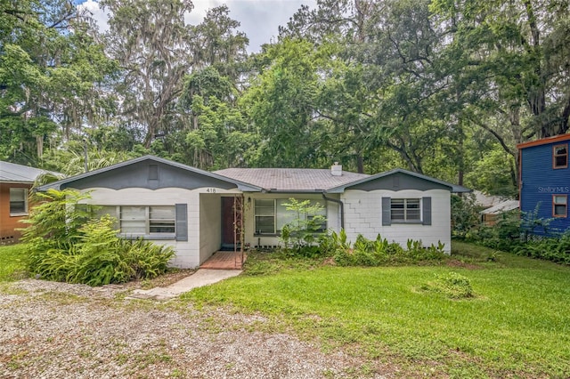 418 NW 27th Ter, Gainesville, FL 32607 - single story home with a front yard and a chimney