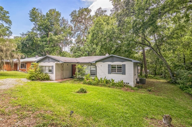 418 NW 27th Ter, Gainesville, FL 32607 - ranch-style house with a front lawn and a chimney