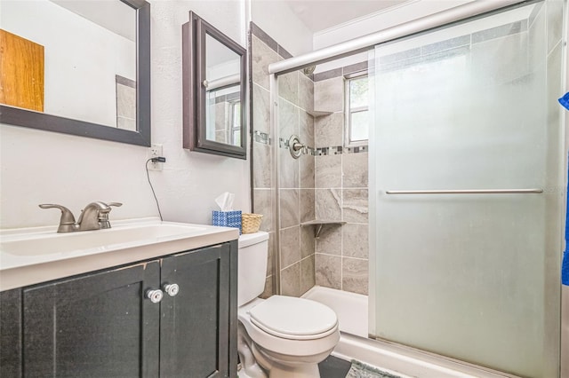 418 NW 27th Ter, Gainesville, FL 32607 - full bathroom featuring a shower stall, vanity, and a textured wall