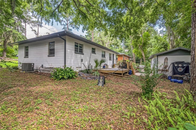 418 NW 27th Ter, Gainesville, FL 32607 - rear view of house with a deck