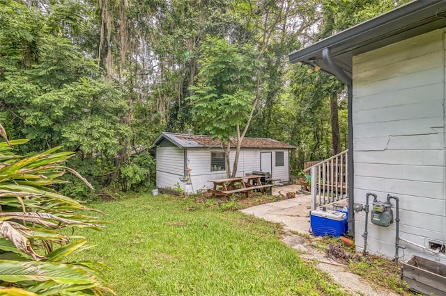 418 NW 27th Ter, Gainesville, FL 32607 - view of green lawn featuring an outbuilding