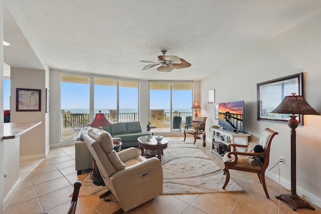 20 Porto Mar Unit 302, Palm Coast, FL 32137 - living room with light tile patterned flooring and a ceiling fan