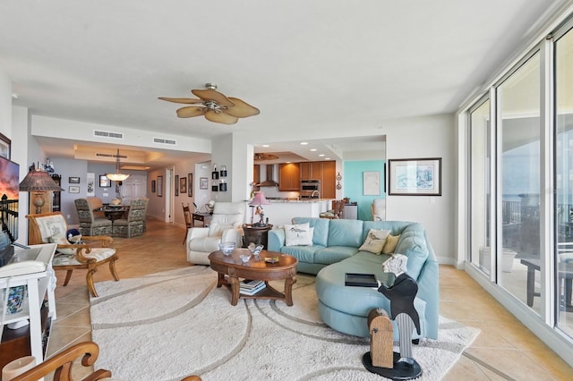 20 Porto Mar Unit 302, Palm Coast, FL 32137 - living area with light tile patterned floors and ceiling fan