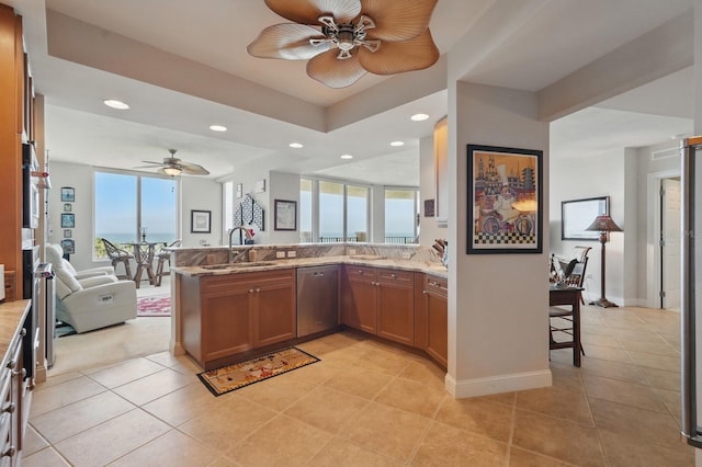 20 Porto Mar Unit 302, Palm Coast, FL 32137 - kitchen with stainless steel dishwasher, open floor plan, ceiling fan, healthy amount of natural light, and recessed lighting