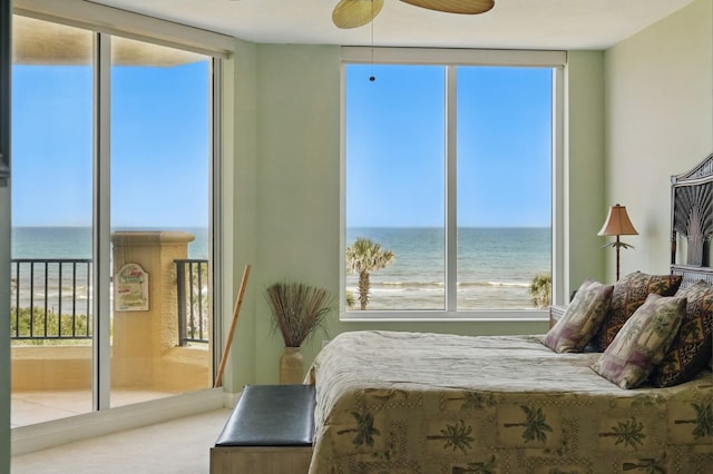 20 Porto Mar Unit 302, Palm Coast, FL 32137 - carpeted bedroom featuring a water view and multiple windows