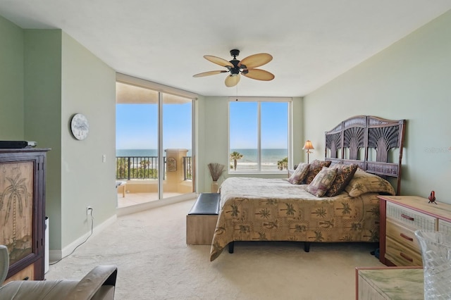 20 Porto Mar Unit 302, Palm Coast, FL 32137 - bedroom featuring access to exterior, a water view, carpet, floor to ceiling windows, and ceiling fan