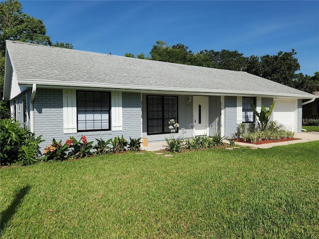 1810 Western Rd, South Daytona, FL 32119 - single story home with brick siding, an attached garage, a front lawn, roof with shingles, and a porch
