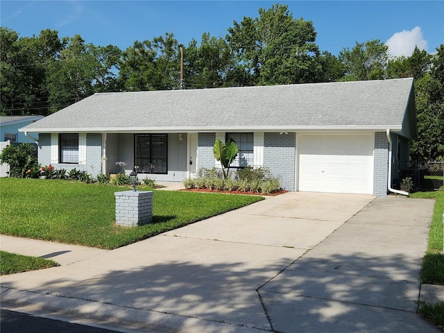 1810 Western Rd, South Daytona, FL 32119 - single story home featuring brick siding, an attached garage, a front yard, concrete driveway, and a shingled roof