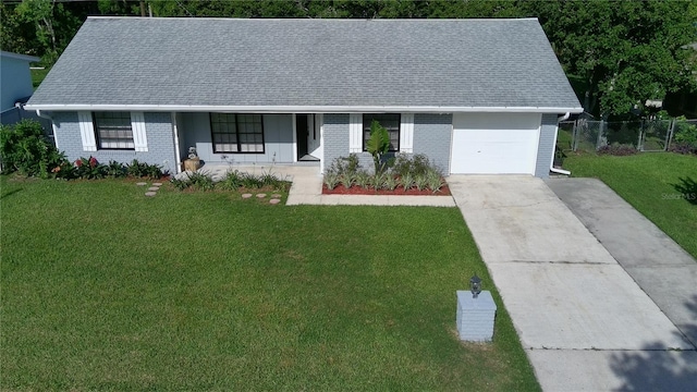 1810 Western Rd, South Daytona, FL 32119 - single story home featuring a garage, driveway, brick siding, and a shingled roof