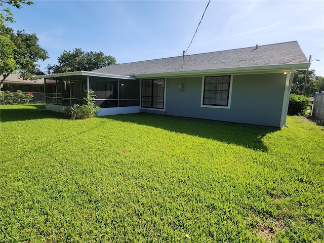 1810 Western Rd, South Daytona, FL 32119 - rear view of property with a sunroom and roof with shingles