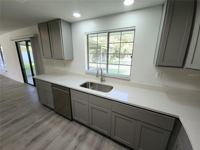 1810 Western Rd, South Daytona, FL 32119 - kitchen featuring dishwasher, gray cabinetry, light wood-style flooring, light countertops, and recessed lighting