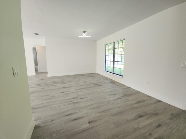 1810 Western Rd, South Daytona, FL 32119 - empty room featuring wood finished floors and arched walkways