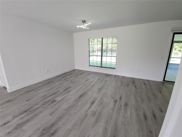 1810 Western Rd, South Daytona, FL 32119 - empty room with wood finished floors and baseboards