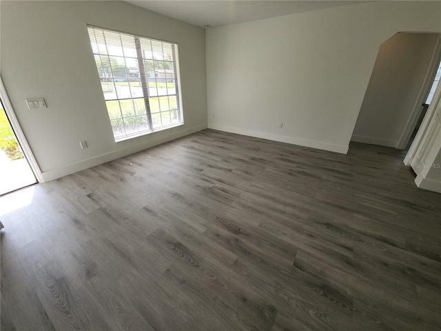 1810 Western Rd, South Daytona, FL 32119 - unfurnished room with dark wood finished floors and baseboards