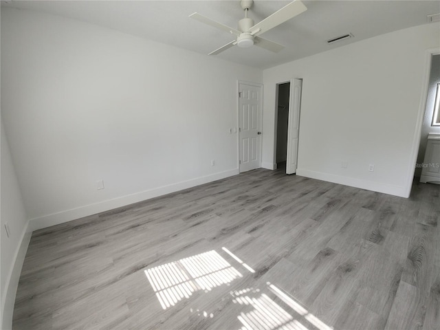 1810 Western Rd, South Daytona, FL 32119 - unfurnished bedroom featuring wood finished floors and a ceiling fan