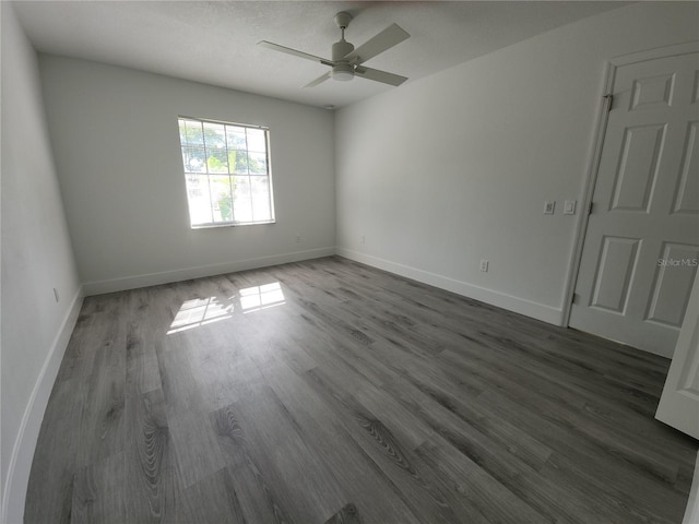 1810 Western Rd, South Daytona, FL 32119 - unfurnished room featuring dark wood finished floors and a ceiling fan