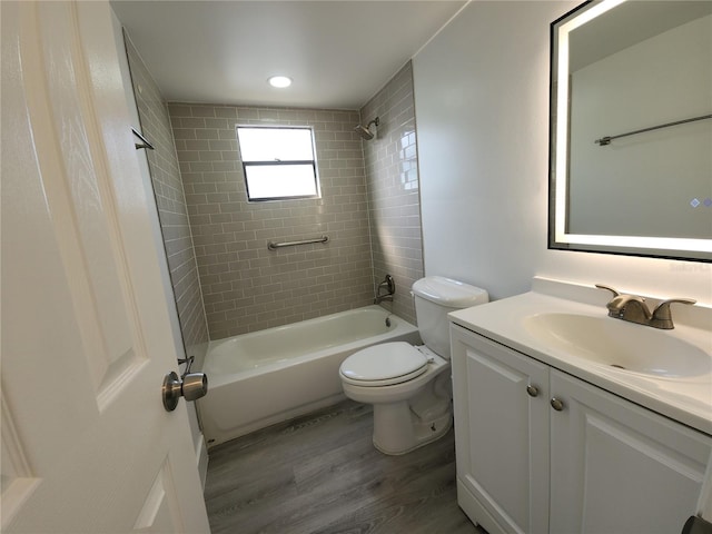 1810 Western Rd, South Daytona, FL 32119 - full bath with wood finished floors, vanity, and bathtub / shower combination