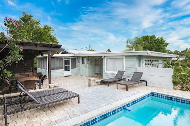 159 Southwind Cir, Saint Augustine, FL 32080 - rear view of house featuring a sunroom and a patio