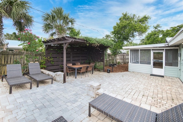 159 Southwind Cir, Saint Augustine, FL 32080 - fenced backyard featuring a sunroom, a pergola, outdoor dining area, and a patio