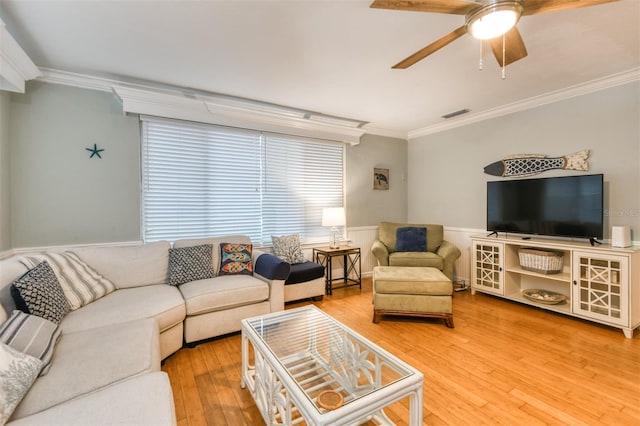 159 Southwind Cir, Saint Augustine, FL 32080 - living area featuring ornamental molding, ceiling fan, hardwood / wood-style flooring, and wainscoting
