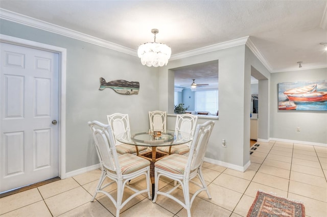 159 Southwind Cir, Saint Augustine, FL 32080 - dining space featuring light tile patterned floors, ornamental molding, a chandelier, and a ceiling fan