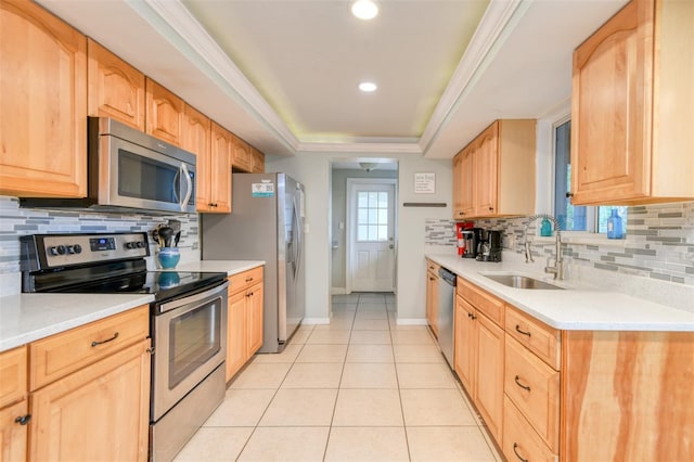 159 Southwind Cir, Saint Augustine, FL 32080 - kitchen with stainless steel appliances, light countertops, a raised ceiling, and recessed lighting