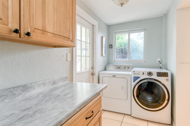 159 Southwind Cir, Saint Augustine, FL 32080 - laundry room featuring separate washer and dryer, cabinet space, and light tile patterned flooring