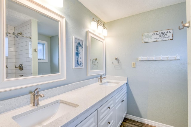 159 Southwind Cir, Saint Augustine, FL 32080 - full bath featuring double vanity, a shower, and wood finished floors