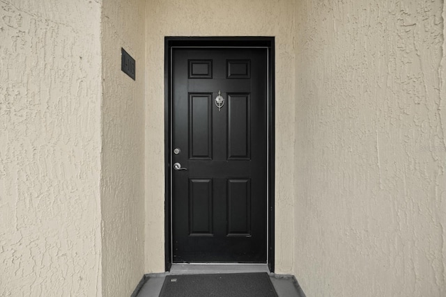 100 Bella Harbor Ct Unit 103, Palm Coast, FL 32137 - entrance to property featuring stucco siding