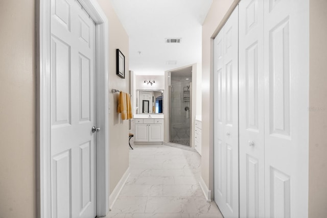 100 Bella Harbor Ct Unit 103, Palm Coast, FL 32137 - corridor with light marble finish flooring and baseboards