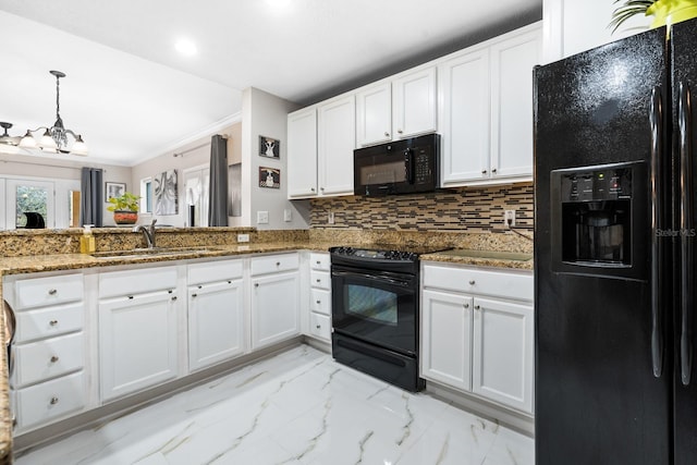100 Bella Harbor Ct Unit 103, Palm Coast, FL 32137 - kitchen with black appliances, white cabinetry, stone countertops, light marble finish flooring, and backsplash
