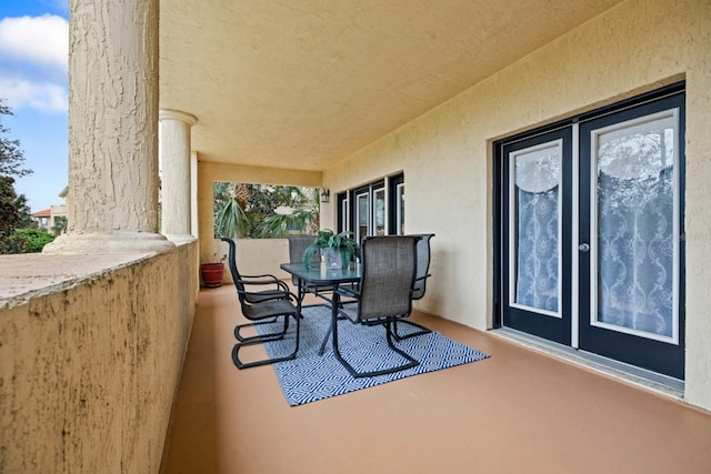 100 Bella Harbor Ct Unit 103, Palm Coast, FL 32137 - patio / terrace featuring french doors and outdoor dining space