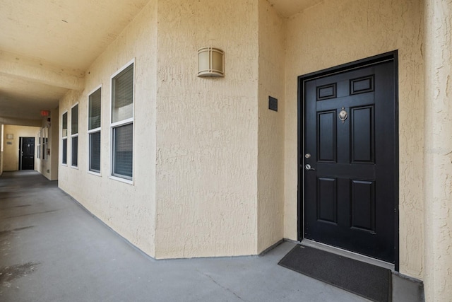 100 Bella Harbor Ct Unit 103, Palm Coast, FL 32137 - property entrance featuring stucco siding
