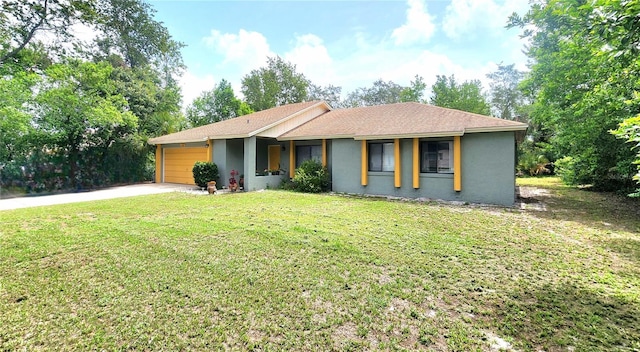 1561 Copperfield Ave, Deltona, FL 32738 - ranch-style home featuring a garage, driveway, a front lawn, and stucco siding