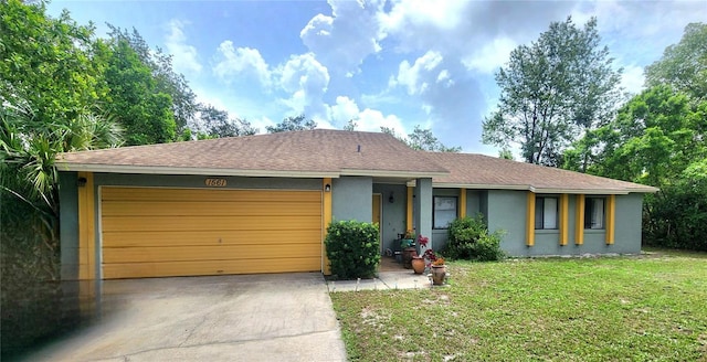 1561 Copperfield Ave, Deltona, FL 32738 - view of front facade with stucco siding, concrete driveway, an attached garage, a front yard, and roof with shingles