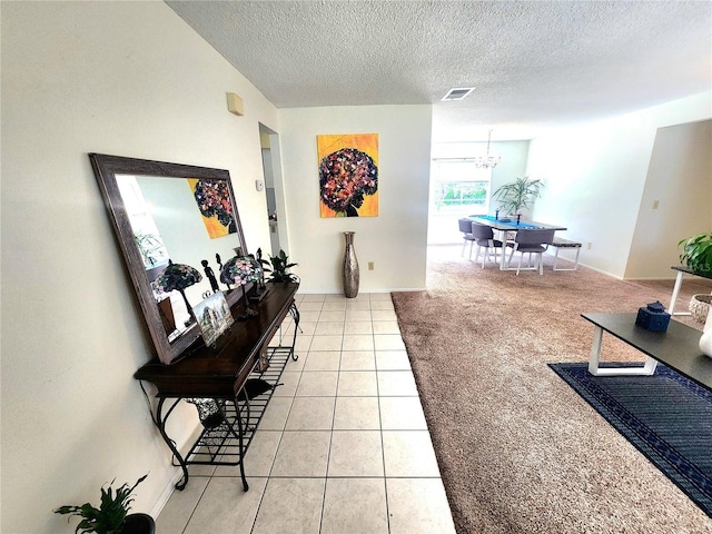 1561 Copperfield Ave, Deltona, FL 32738 - living room with a textured ceiling, light tile patterned floors, and a chandelier
