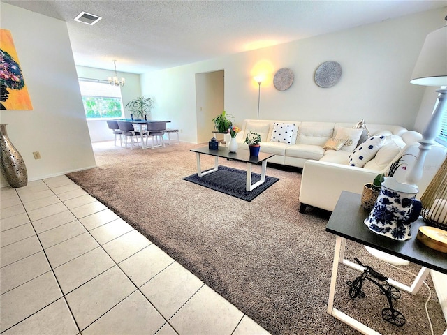 1561 Copperfield Ave, Deltona, FL 32738 - carpeted living room featuring tile patterned floors, a chandelier, and a textured ceiling
