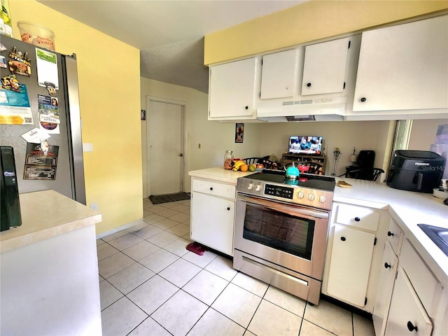 1561 Copperfield Ave, Deltona, FL 32738 - kitchen featuring appliances with stainless steel finishes, under cabinet range hood, light tile patterned floors, light countertops, and white cabinetry