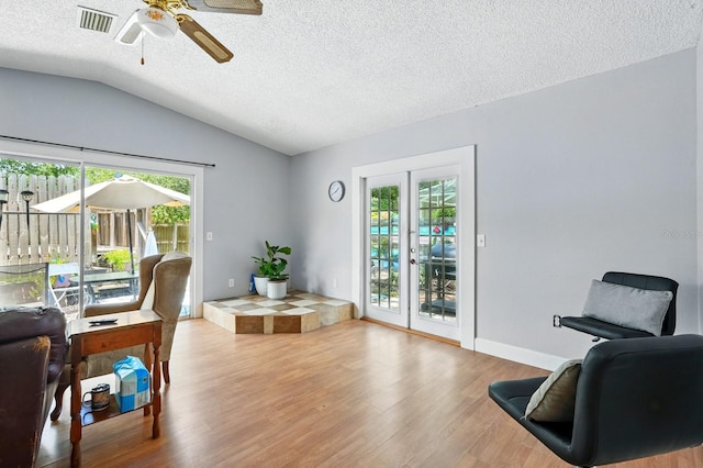 29 Rylin Ln, Palm Coast, FL 32164 - home office with wood finished floors, vaulted ceiling, a textured ceiling, and a ceiling fan