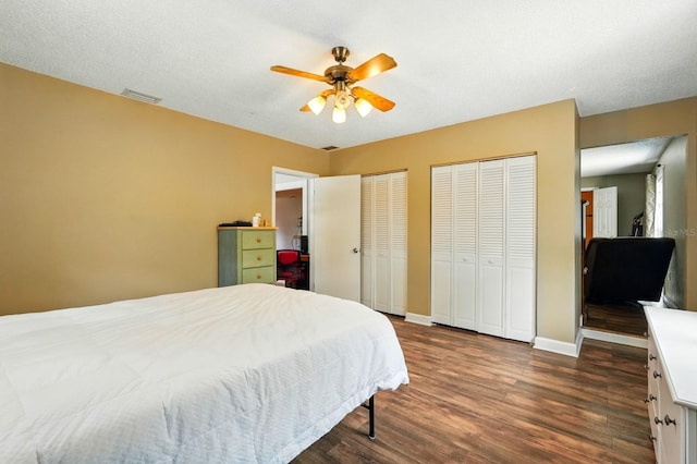 29 Rylin Ln, Palm Coast, FL 32164 - bedroom featuring dark wood-type flooring, two closets, and ceiling fan
