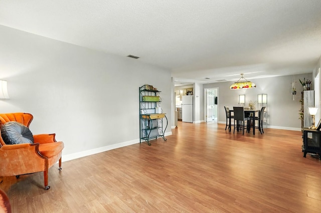 29 Rylin Ln, Palm Coast, FL 32164 - living area featuring light wood-style floors and baseboards