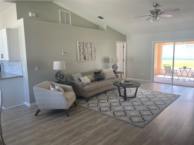 2 Unity Ct, Palm Coast, FL 32164 - living area with ceiling fan, wood finished floors, and high vaulted ceiling