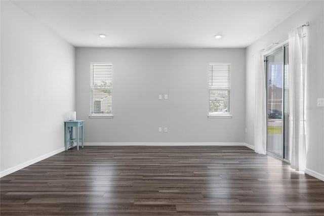 51 Oakleaf Way, Palm Coast, FL 32137 - empty room featuring dark wood finished floors and recessed lighting