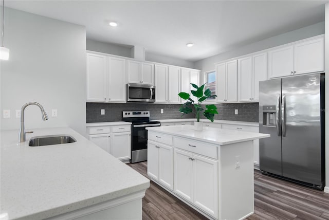 51 Oakleaf Way, Palm Coast, FL 32137 - kitchen with stainless steel appliances, dark wood-style floors, tasteful backsplash, white cabinetry, and recessed lighting