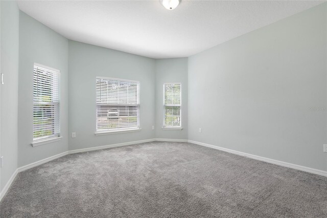 51 Oakleaf Way, Palm Coast, FL 32137 - carpeted empty room with baseboards