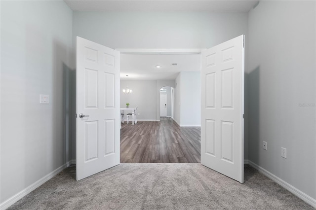 51 Oakleaf Way, Palm Coast, FL 32137 - carpeted empty room featuring arched walkways and baseboards