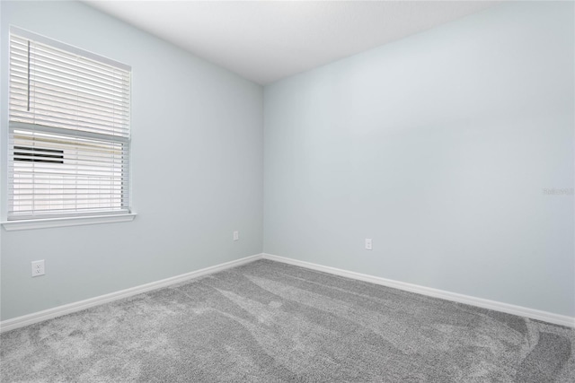 51 Oakleaf Way, Palm Coast, FL 32137 - empty room with carpet and baseboards