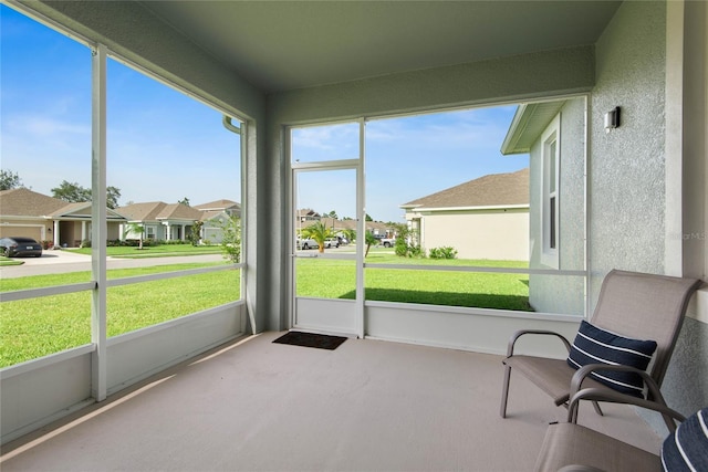 51 Oakleaf Way, Palm Coast, FL 32137 - sunroom / solarium with a residential view