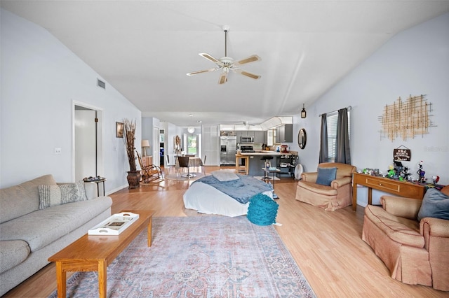 152 Fenimore Ln Unit A & B, Palm Coast, FL 32137 - living area featuring lofted ceiling, ceiling fan, and light wood-style flooring